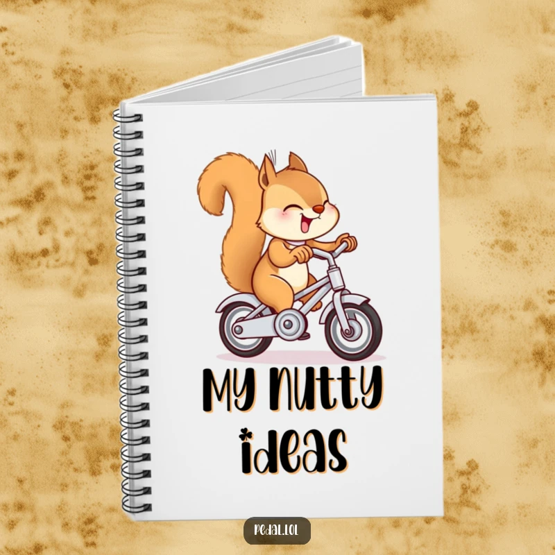 Funny squirrel ringing a miniature bike bell on a notebook, a humorous and practical gift for journaling and note-taking.
