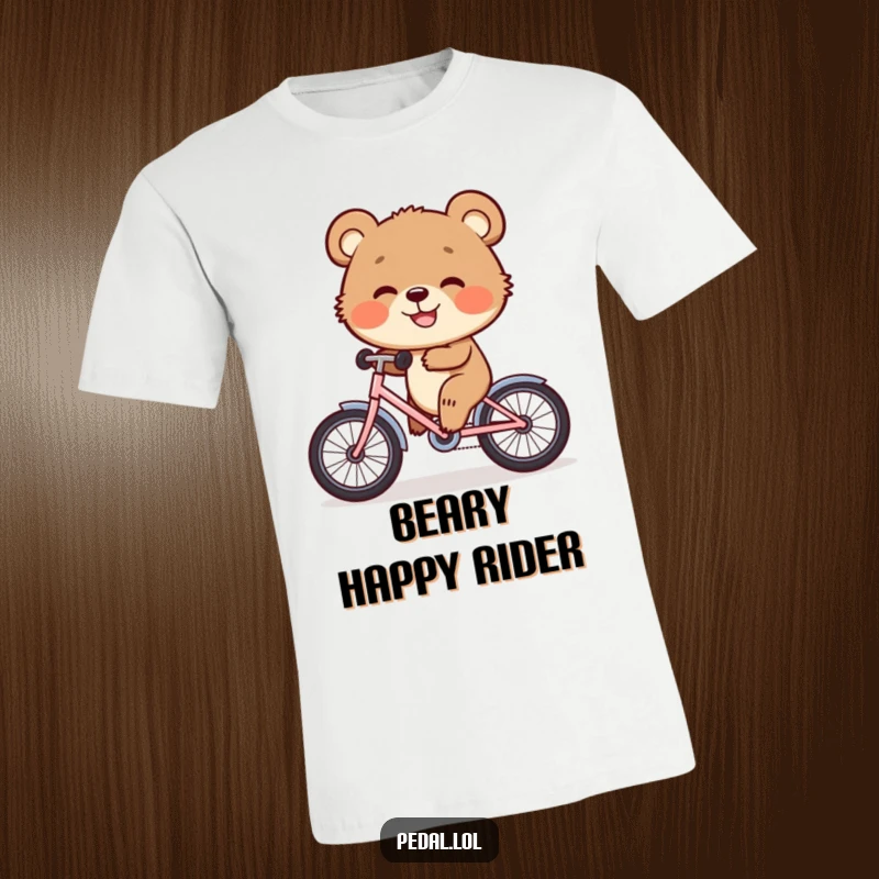 Funny T-Shirt: A happy bear cub joyfully pedals a small bicycle, its big grin radiating pure, childlike delight.